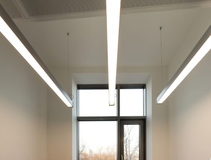 Empty office room with window and interior lighting